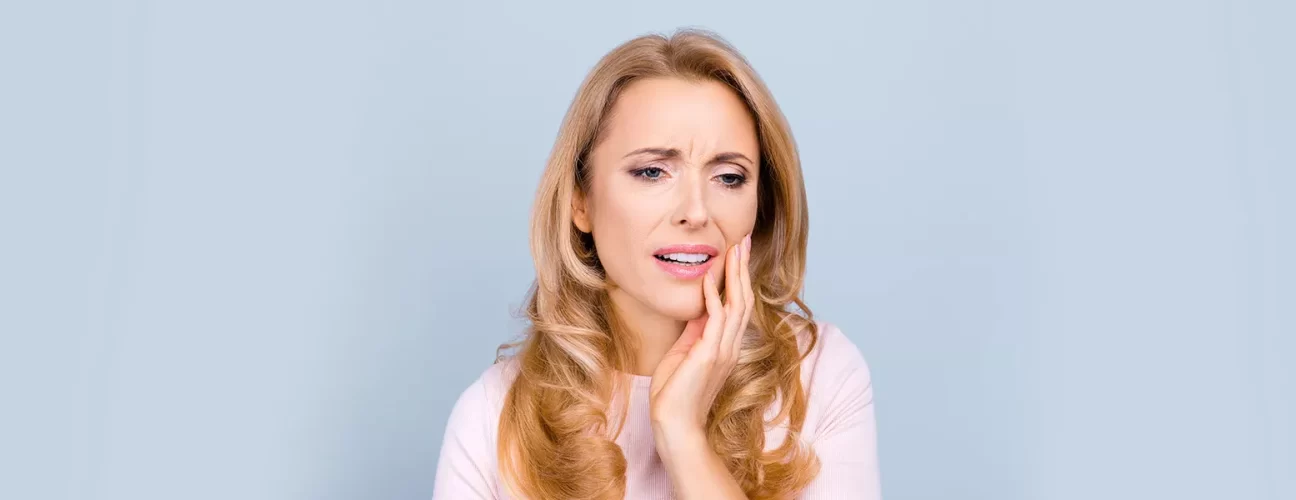 Why is My Gum Swollen Around One Tooth: Causes and Treatments